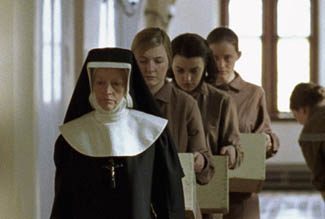 Sister Mary nicely avoids the embarrassment of wearing the same outfit as the other girls.