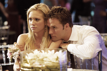 He's totally just about to look down her dress