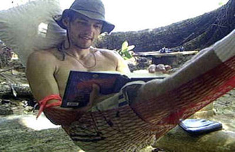 Three guesses what he's reading: hint - it's not Penthouse Letters.