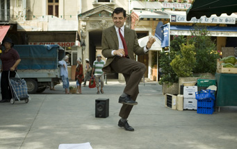 Mr. Bean dances as he realizes the ridiculous amounts of money he has made...but not in America.