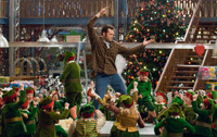 The elves aren't short. Vince Vaughn is just that tall.