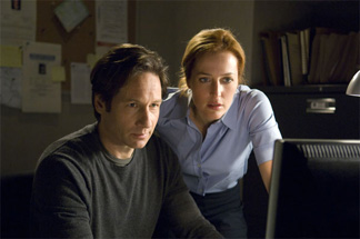 Mulder and Scully are not happy to see box office numbers on their computer.