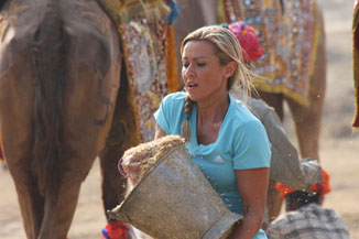 She can't even carry a bucket correctly.