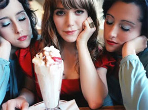 For a girl with an ice cream sundae, she doesn't look happy.