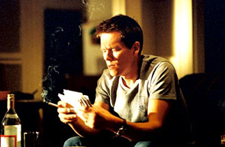 Kevin Bacon reads his fan mail.